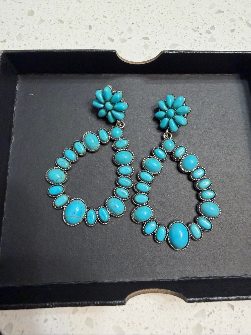 Turquoise colored earrings